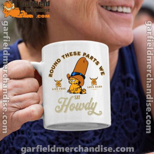 round these parts we love garfiel cowboy white coffee mug