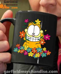 garfield in the garden black coffee mug