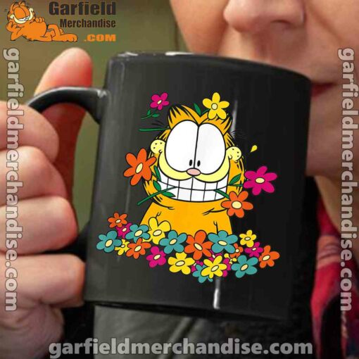 garfield in the garden black coffee mug