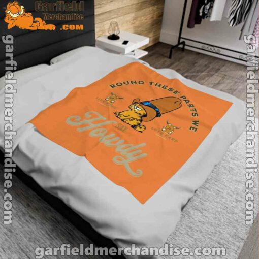 round these parts we love garfiel cowboy orange blanket